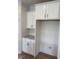 Kitchen featuring white cabinets, a built-in microwave, and granite countertops at 93 Ausban Ridge Ln # 033, Four Oaks, NC 27524