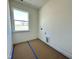 Bright laundry room with a large window and hookups for a washer and dryer at 93 Ausban Ridge Ln # 033, Four Oaks, NC 27524