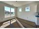 Bright living room with multiple windows overlooking the exterior of the home at 93 Ausban Ridge Ln # 033, Four Oaks, NC 27524
