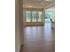 Open-concept living room with beautiful wood flooring and a view of the backyard at 93 Ausban Ridge Ln # 033, Four Oaks, NC 27524