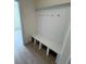 Mudroom area with seating and hooks for storage, and vinyl flooring at 93 Ausban Ridge Ln # 033, Four Oaks, NC 27524