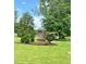 Berea Farms stone sign surrounded by green grass, landscaping and mature trees on a sunny day at 93 Ausban Ridge Ln # 033, Four Oaks, NC 27524
