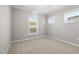 Comfortable bedroom with plush carpeting and natural light from the windows at 102 Belmont Stakes Ln, Wendell, NC 27591