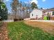 Large backyard with patio and grassy area at 10509 Cokesbury Ln, Raleigh, NC 27614