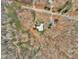 Aerial view of a home surrounded by lush, mature trees at 1126 Trailwood Dr, Raleigh, NC 27606