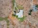 An aerial view of a home nestled among trees, featuring a well-maintained roof and landscaping at 1126 Trailwood Dr, Raleigh, NC 27606