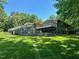 Expansive backyard featuring a multi-level deck and patio, ideal for outdoor living and entertaining at 1126 Trailwood Dr, Raleigh, NC 27606