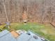 Aerial shot showcases the back yard's play set and platform, along with an expansive, multi-level deck at 1126 Trailwood Dr, Raleigh, NC 27606
