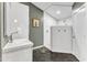 Updated bathroom with a walk-in shower featuring white subway tile and modern fixtures at 1126 Trailwood Dr, Raleigh, NC 27606