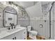 Charming bathroom with patterned wallpaper, modern vanity, and walk-in shower at 1126 Trailwood Dr, Raleigh, NC 27606