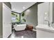 Beautiful bathroom featuring a soaking tub, stylish fixtures, and modern design elements at 1126 Trailwood Dr, Raleigh, NC 27606