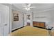 Simple bedroom featuring wood floors, a fan, and a dresser at 1126 Trailwood Dr, Raleigh, NC 27606