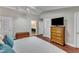 Bedroom with ceiling fan and view of the bathroom at 1126 Trailwood Dr, Raleigh, NC 27606