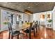 Dining room with large table, seating for ten and wood floors at 1126 Trailwood Dr, Raleigh, NC 27606