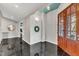 Foyer features tile flooring, front door with glass and a view of the yard at 1126 Trailwood Dr, Raleigh, NC 27606