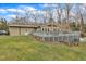 Back of house featuring a deck and large yard with mature trees and a patio at 1126 Trailwood Dr, Raleigh, NC 27606