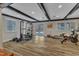 Bright home gym with modern equipment and a sliding glass door to the outside at 1126 Trailwood Dr, Raleigh, NC 27606