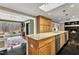 Kitchen with granite countertop, tile floor, and view into the living area at 1126 Trailwood Dr, Raleigh, NC 27606