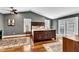 Spacious main bedroom features hardwood floors, vaulted ceilings, and elegant furnishings at 1126 Trailwood Dr, Raleigh, NC 27606