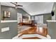 Main bedroom boasts beautiful hardwood floors, vaulted ceilings, and french doors to the outside at 1126 Trailwood Dr, Raleigh, NC 27606
