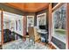 Well-lit home office featuring custom trim, hardwood floors, and wooded view at 1126 Trailwood Dr, Raleigh, NC 27606