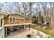Relax on the stamped concrete patio with seating, overlooking the expansive backyard with a swing set at 1126 Trailwood Dr, Raleigh, NC 27606