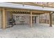Spacious covered stamped concrete patio area with a grill and table for outdoor entertaining at 1126 Trailwood Dr, Raleigh, NC 27606