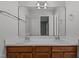 Bathroom with double vanity and wood cabinets at 1322 Cedar Branch Ct, Wake Forest, NC 27587