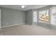 Well-lit bedroom featuring a large window and neutral decor at 1322 Cedar Branch Ct, Wake Forest, NC 27587