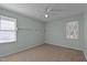 Bedroom with double windows and wall-mounted shelves at 1322 Cedar Branch Ct, Wake Forest, NC 27587
