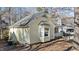 Side view of a yellow house with mature trees and landscaping at 1322 Cedar Branch Ct, Wake Forest, NC 27587
