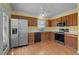 Eat-in kitchen with stainless steel appliances and wood cabinets at 1322 Cedar Branch Ct, Wake Forest, NC 27587