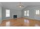 Spacious living room featuring hardwood floors and a fireplace at 1322 Cedar Branch Ct, Wake Forest, NC 27587