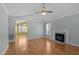Living room with hardwood floors, fireplace, and vaulted ceiling at 1322 Cedar Branch Ct, Wake Forest, NC 27587