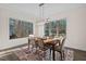 Spacious dining room with wood table and natural light at 2114 Arborwood, Durham, NC 27705