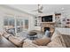 Living room boasts built-in shelving, a fireplace, and access to a screened porch at 2114 Arborwood, Durham, NC 27705