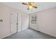 Bedroom with double doors and window, featuring a neutral color scheme at 216 Burkwood Ln, Raleigh, NC 27609