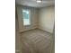 Bedroom with new carpet, window, and fresh paint at 233 N Movado Trl, Kenly, NC 27542