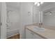 Bathroom with a shower-tub combo, exhaust fan and a large mirror above the vanity at 2332 Turtle Point Dr, Raleigh, NC 27604