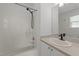 Bathroom featuring a shower-tub combo, exhaust fan and a large mirror above the vanity at 2332 Turtle Point Dr, Raleigh, NC 27604