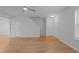 Spacious living area with light wood floors, offering a blank canvas for your decorating ideas at 2332 Turtle Point Dr, Raleigh, NC 27604