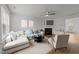 Bright living room featuring a comfortable sectional sofa, fireplace, and neutral décor, perfect for relaxation at 2332 Turtle Point Dr, Raleigh, NC 27604