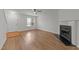 Bright room featuring light wood floors and a fireplace, creating a warm and inviting space at 2332 Turtle Point Dr, Raleigh, NC 27604