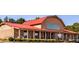 Brick building with red roof and porch, great curb appeal at 257 Hank Way, Angier, NC 27501