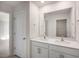 Double vanity bathroom with a large mirror at 264 Hawksmoore Ln, Lillington, NC 27546