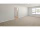 Spacious bedroom with large window and walk-in closet at 264 Hawksmoore Ln, Lillington, NC 27546