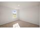 Bright bedroom with a window and neutral decor at 264 Hawksmoore Ln, Lillington, NC 27546
