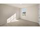 Simple bedroom with carpeted floor and a window with a view at 264 Hawksmoore Ln, Lillington, NC 27546
