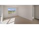 Well-lit bedroom with carpet and a view at 264 Hawksmoore Ln, Lillington, NC 27546