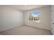 Bright bedroom with window and carpet flooring at 264 Hawksmoore Ln, Lillington, NC 27546